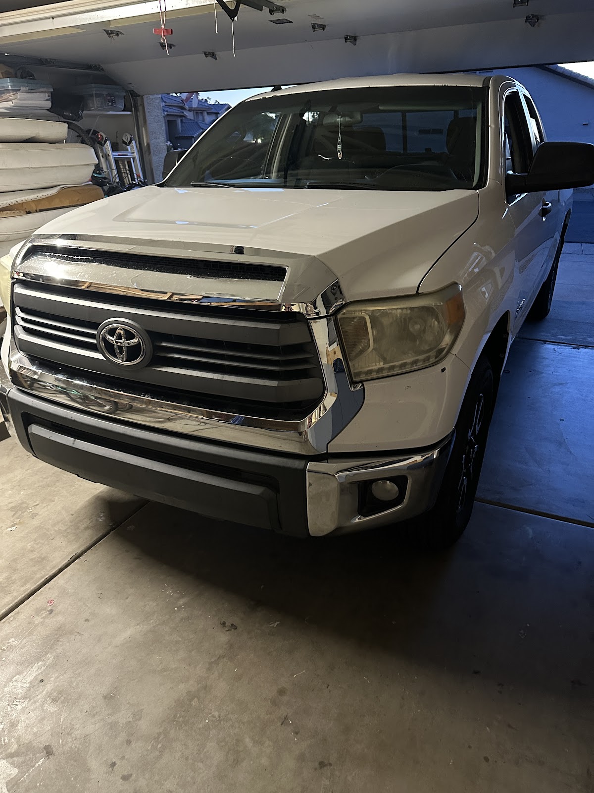 White Toyota Tundra parked inside a customer's home garage